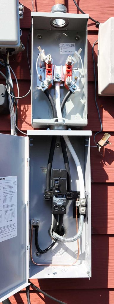 Disconnect box installation featuring electrical connections, circuit breakers, and wiring, showcasing Nalset Electrical Services' expertise in electrical upgrades.