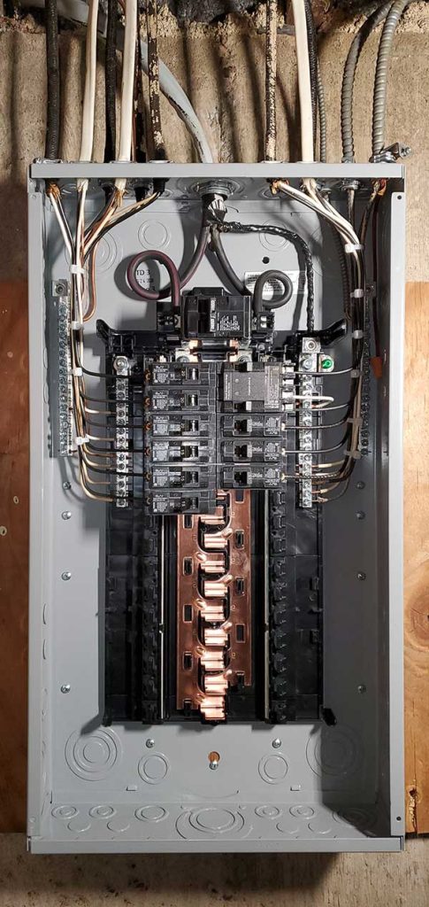 Main electrical panel installation showcasing circuit breakers and wiring, emphasizing electrical service upgrades by Nalset Electrical Services.