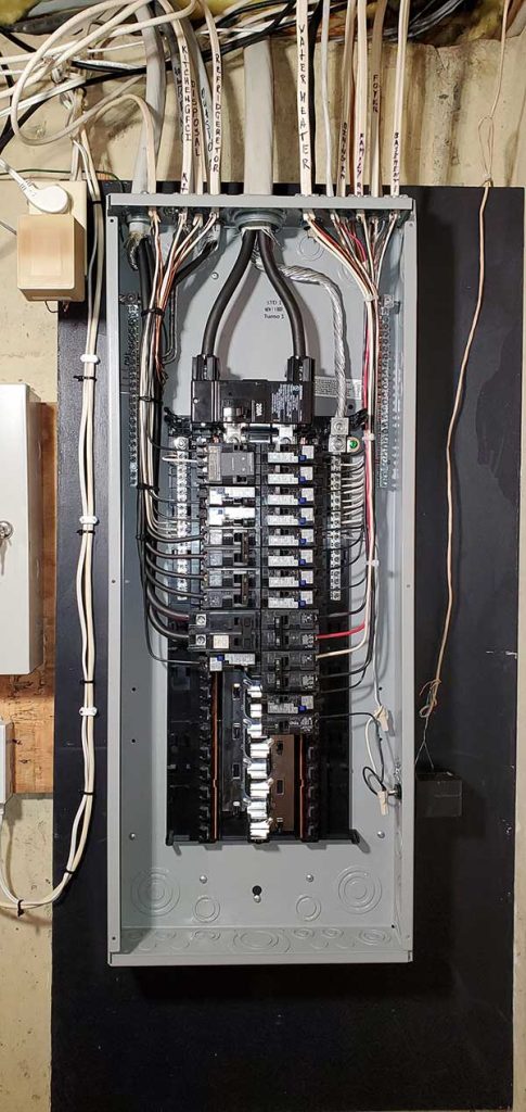 Main electrical panel installation with multiple circuit breakers and wiring, showcasing professional electrical service upgrades by Nalset Electrical Services.