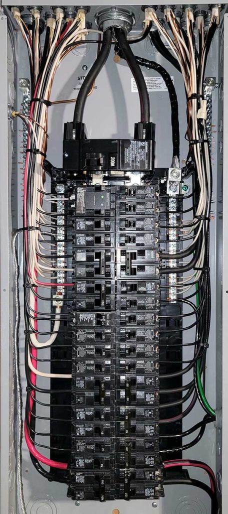 Main electrical panel installation with multiple circuit breakers and wiring, showcasing professional electrical service by Nalset Electrical Services.