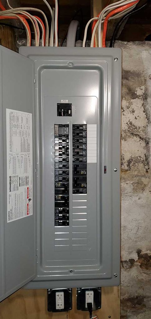 Main electrical panel installation with circuit breakers and wiring, showcasing Nalset Electrical Services' expertise in residential electrical upgrades.