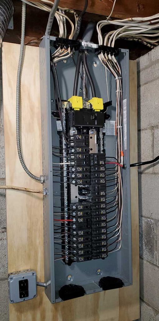 Main electrical panel installation with circuit breakers and wiring, showcasing electrical service upgrades by Nalset Electrical Services.