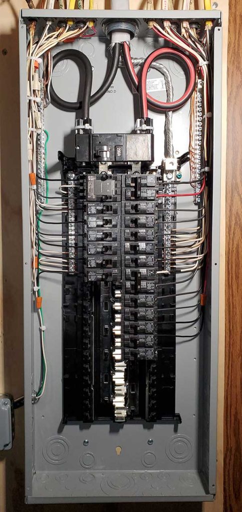 Main electrical panel installation showcasing multiple circuit breakers and electrical wiring, illustrating the quality of electrical service upgrades by Nalset Electrical Services.