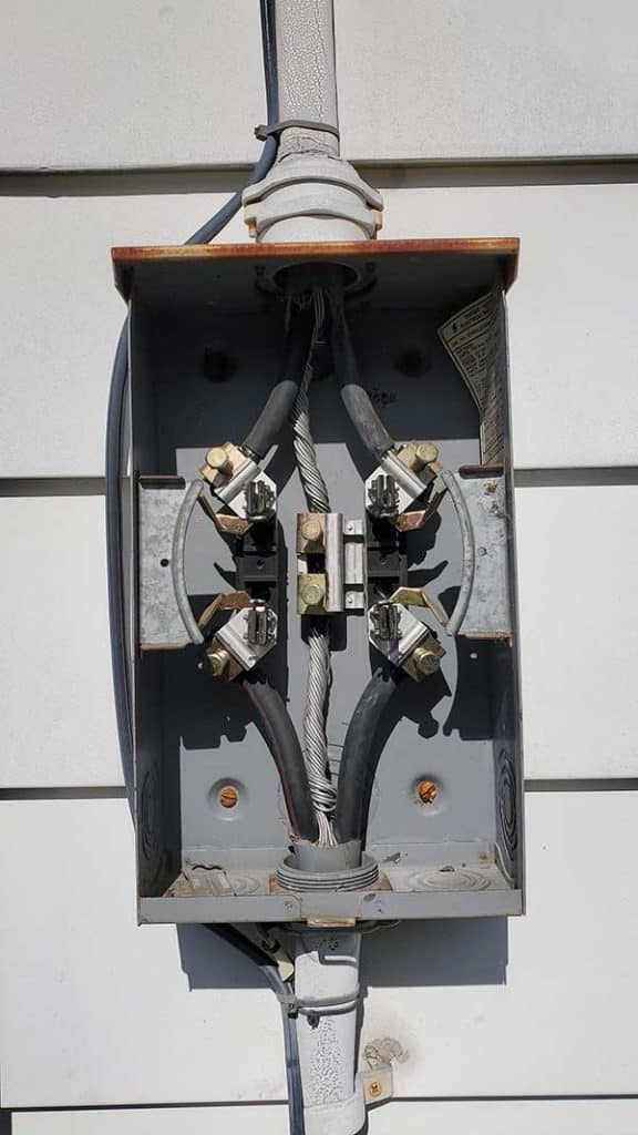 Electrical meter base installation showcasing wiring connections and safety features, relevant to Nalset Electrical Services' emphasis on electrical safety and emergency readiness.